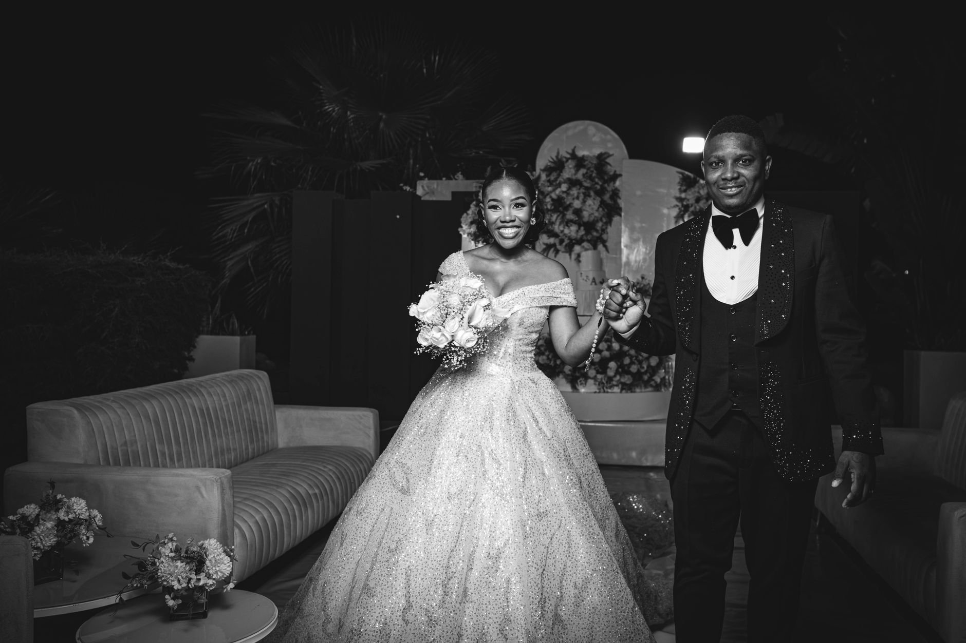 Black and white portrait of a joyful bride and groom at their wedding.